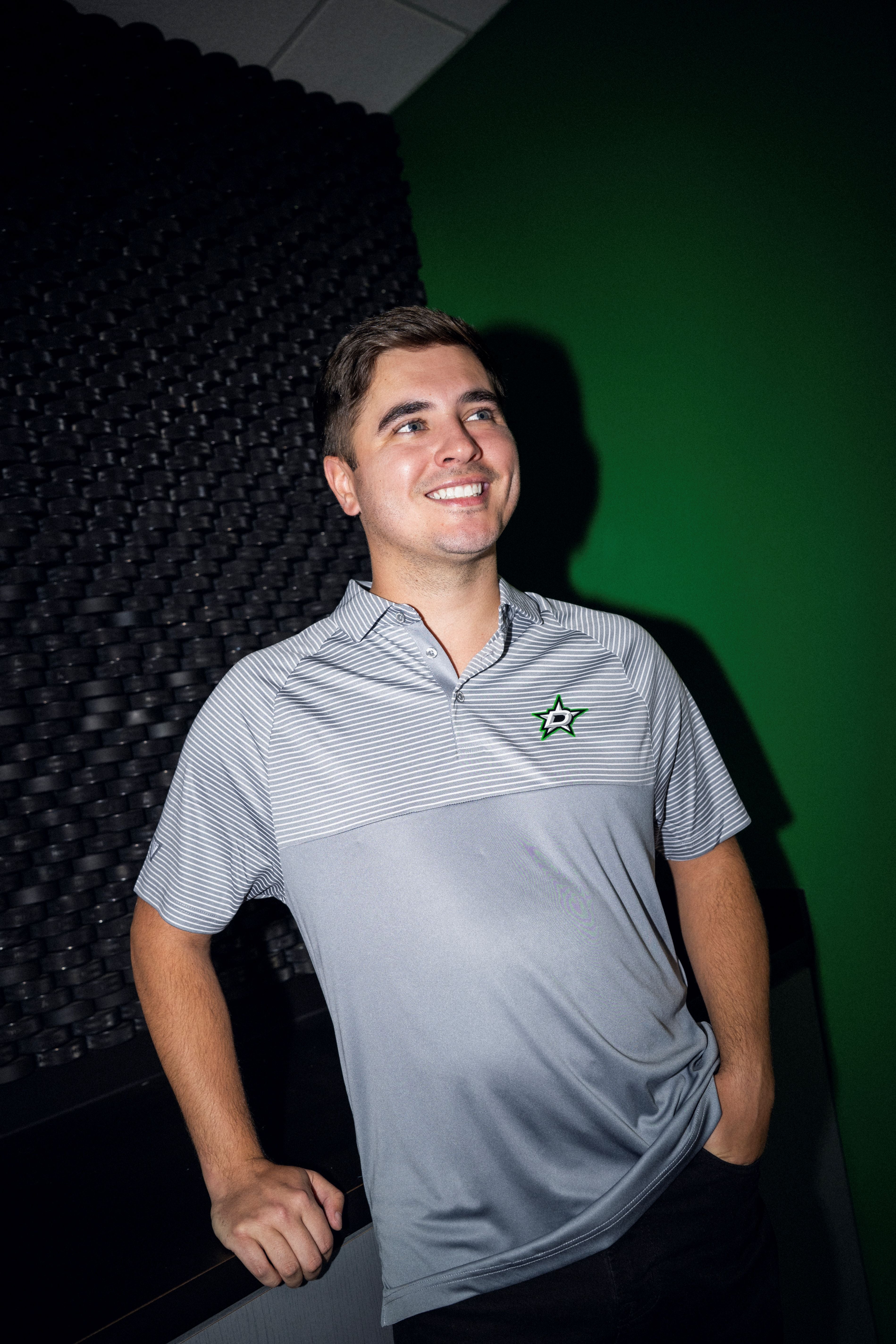 Photo of person wearing a grey polo