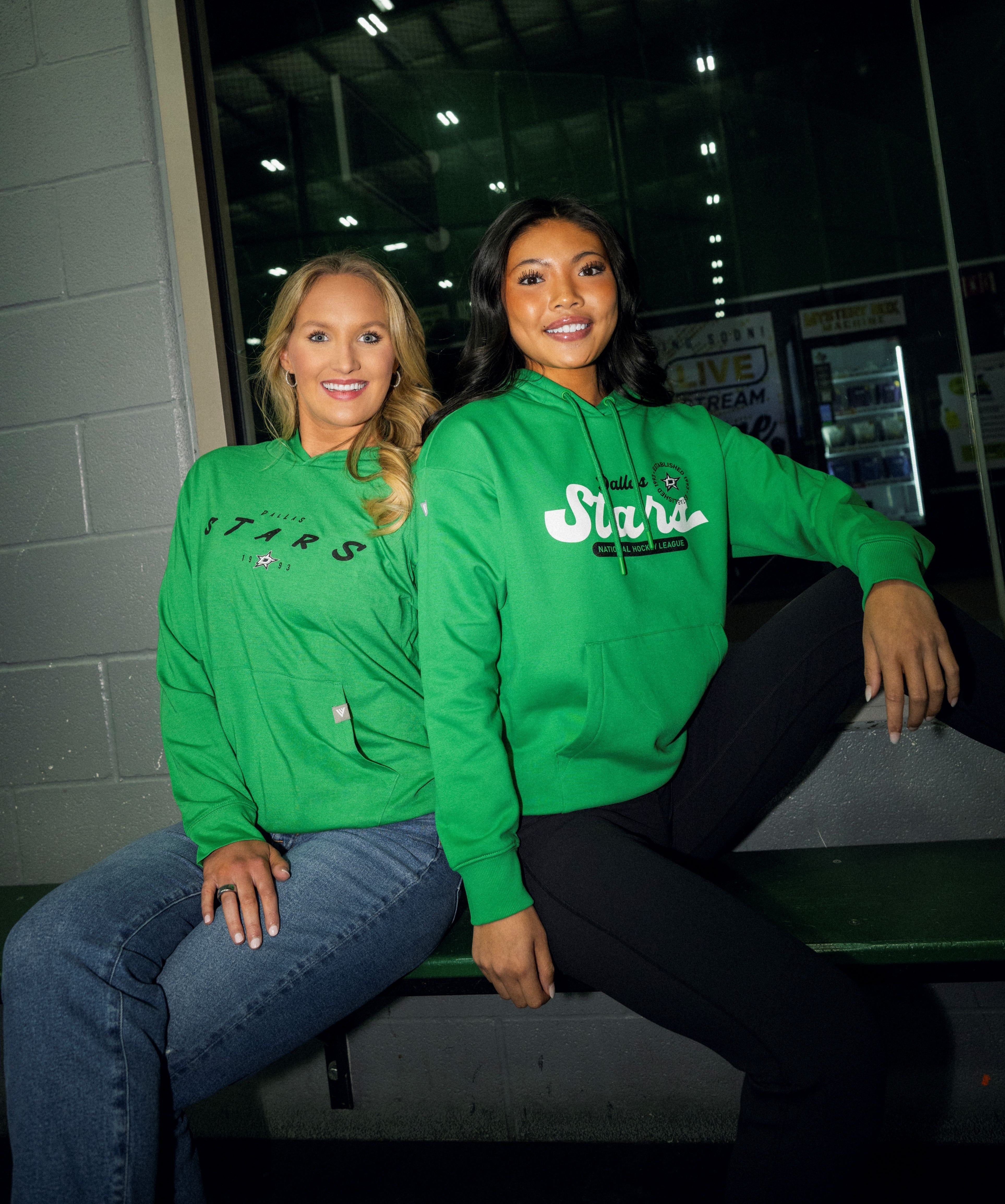 Photo of two girls wearing hoody sweatshirts