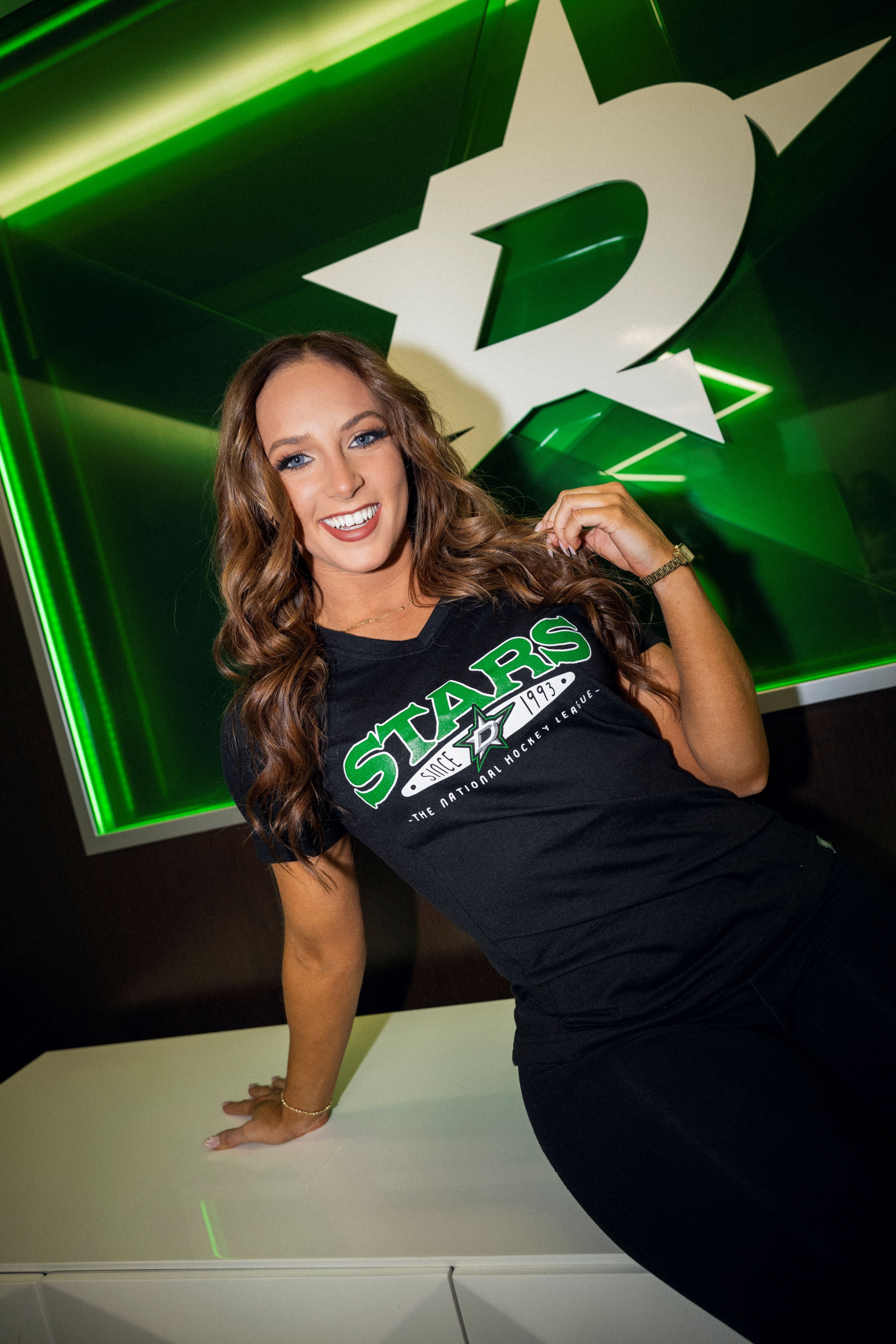 Photo of women wearing a Dallas Stars t-shirt