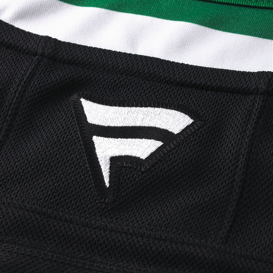 Close-up of a black hockey jersey with Fanatics logo