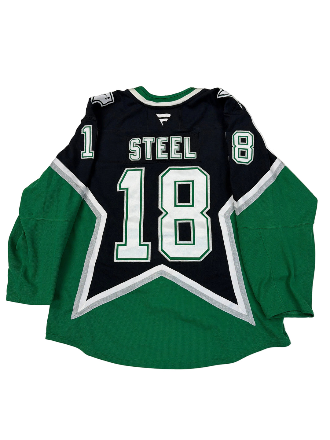 Green and black sports jersey with number 18 on a white floor.