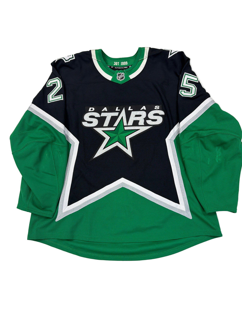 Dallas Stars sports jersey and shorts on a white surface