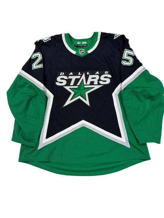 Dallas Stars sports jersey and shorts on a white surface