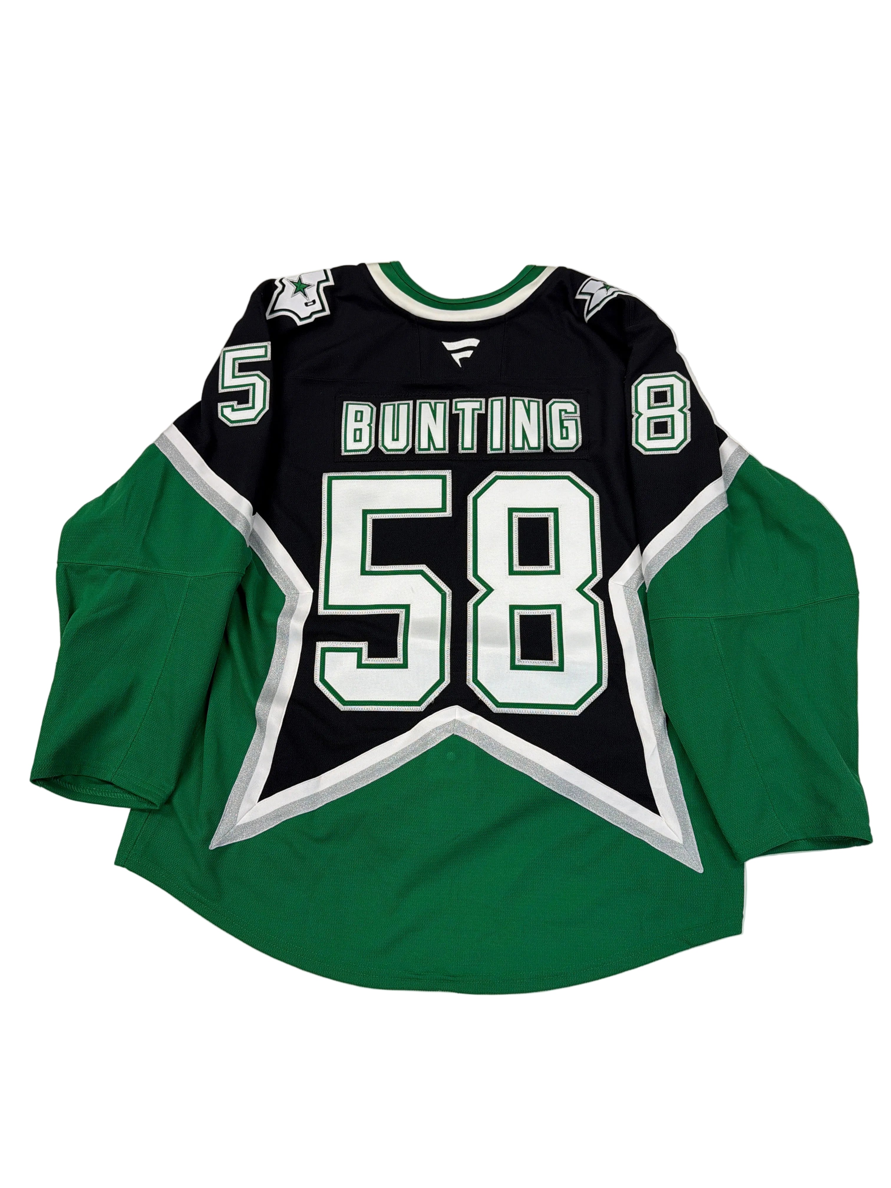Green and black sports jersey with number 8 and name 'Bunting' on a white surface.