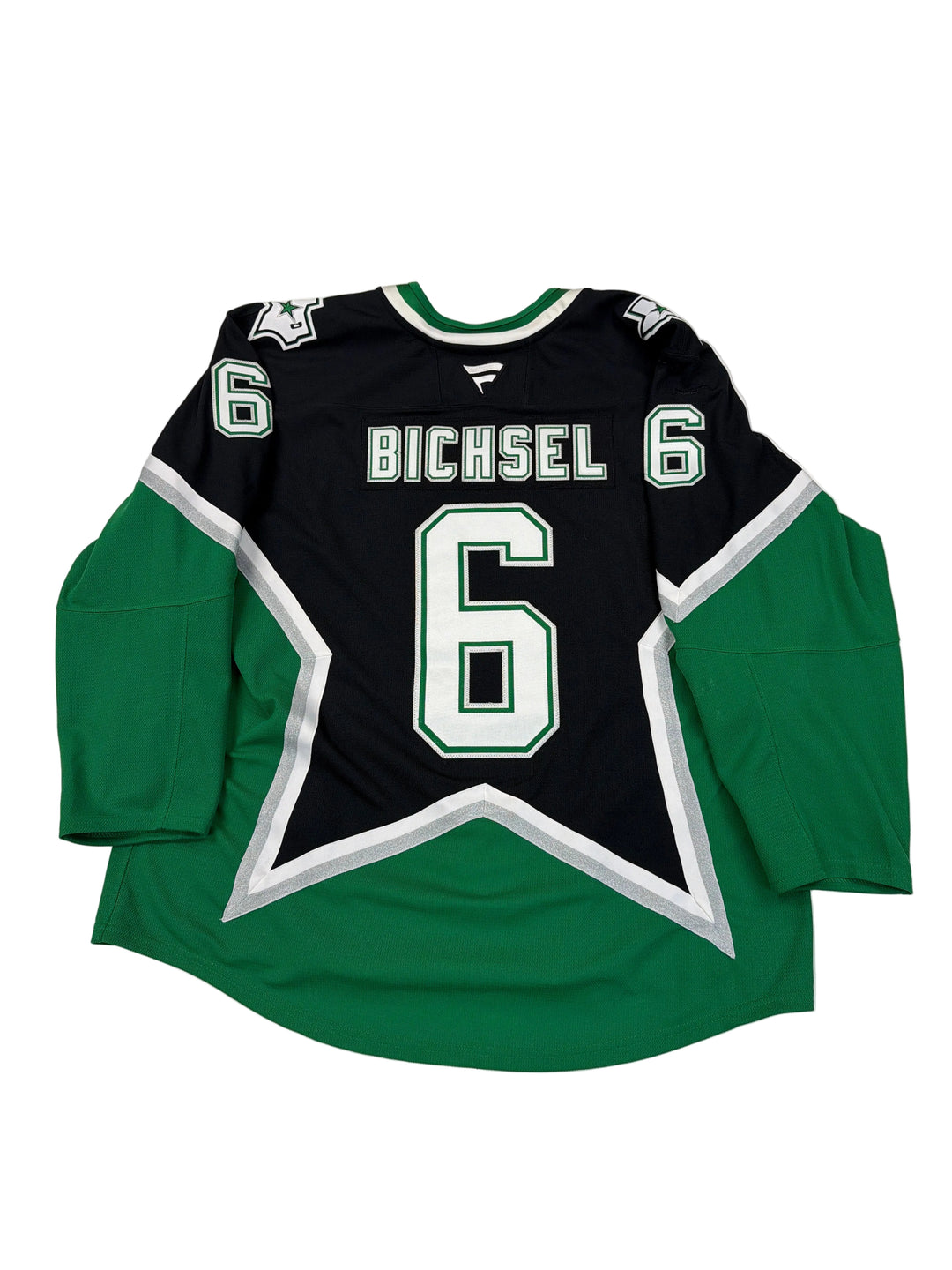 Green and black sports jersey with number 6 and name 'Michel' on a white surface.
