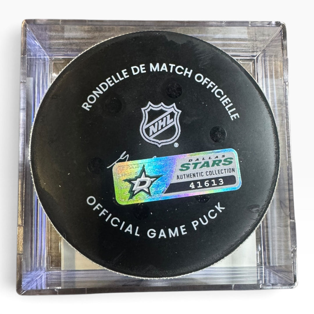 Official NHL Dallas Stars game puck in a clear square display case, featuring the black puck with white text and the Dallas Stars authentic collection sticker.