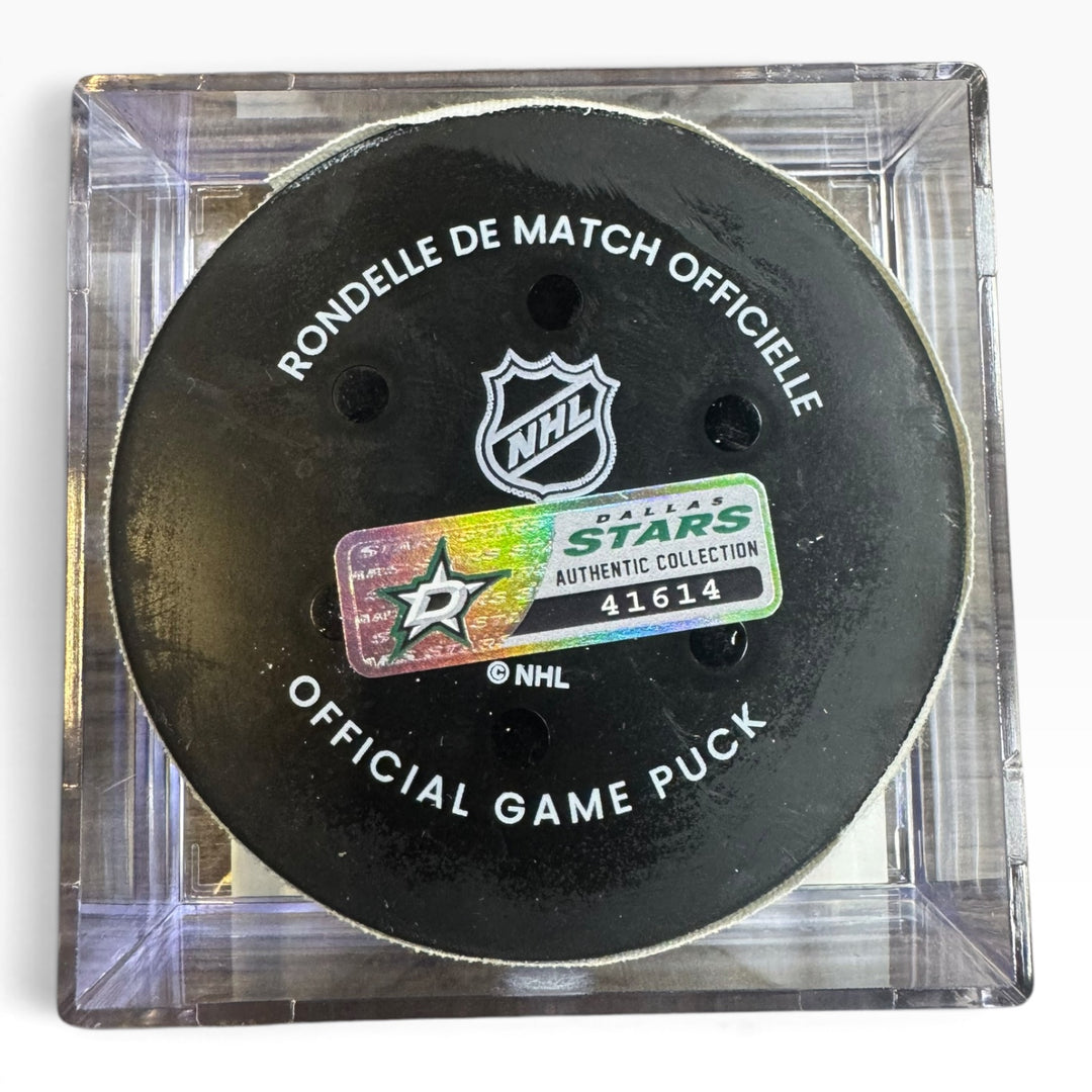 Official Dallas Stars NHL game puck in a clear square display case, featuring the black puck with white text and the Dallas Stars Authentic Collection sticker.