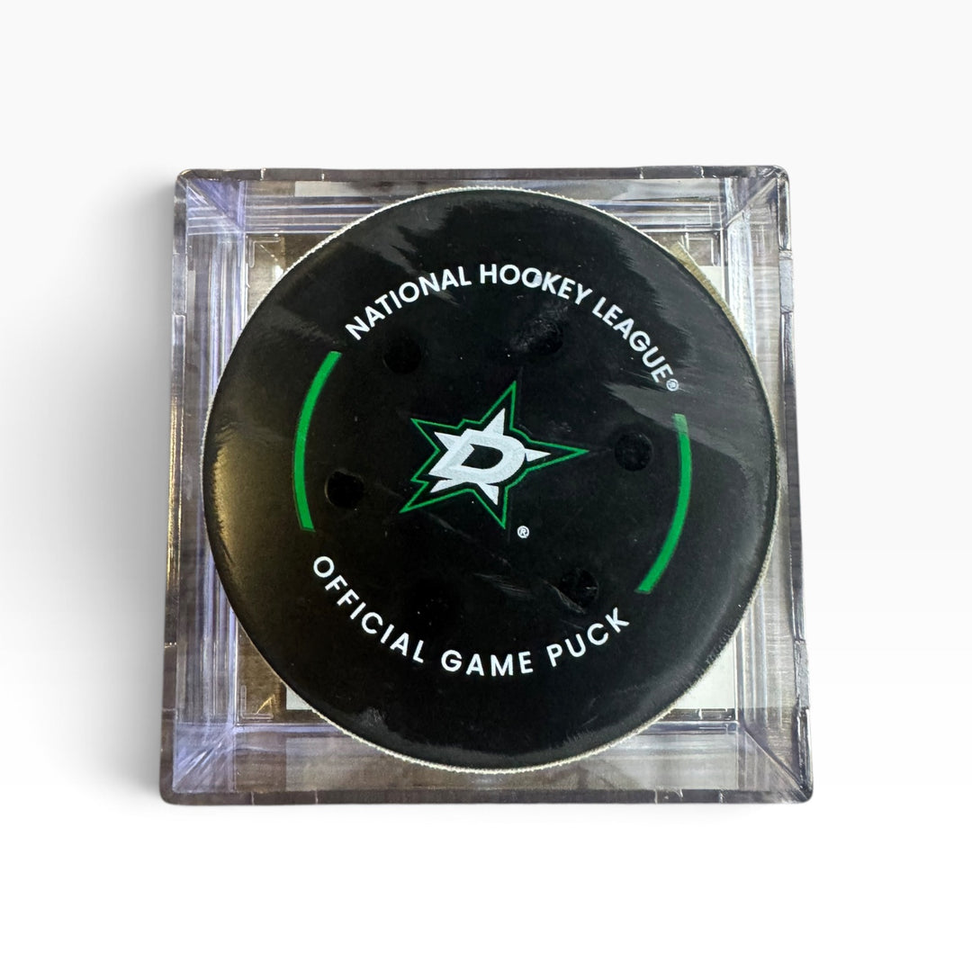 An official NHL hockey puck in a clear acrylic display case, featuring a black puck with white text and the NHL shield logo.
