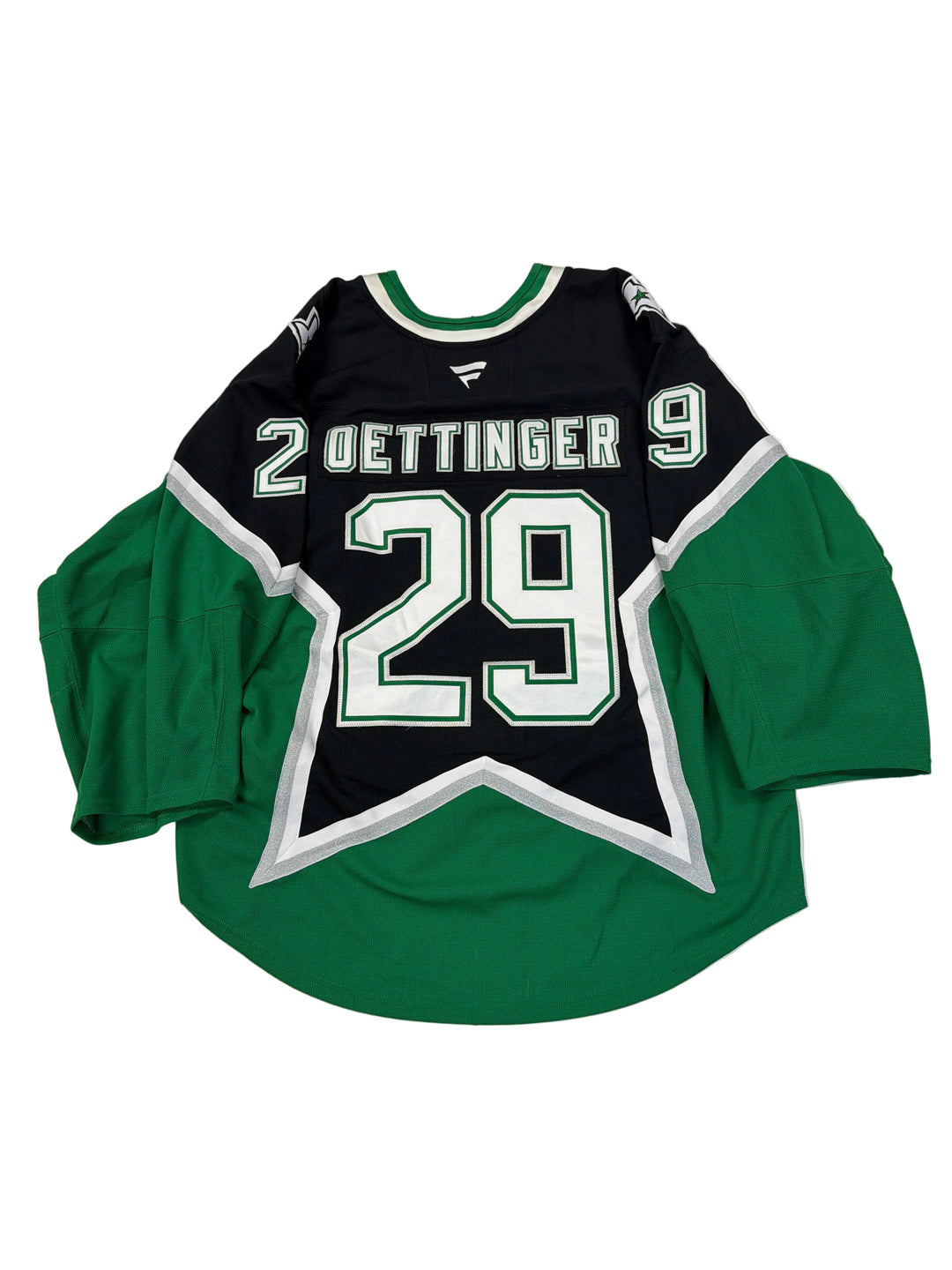 Green and black sports jersey with number 29 on a white surface