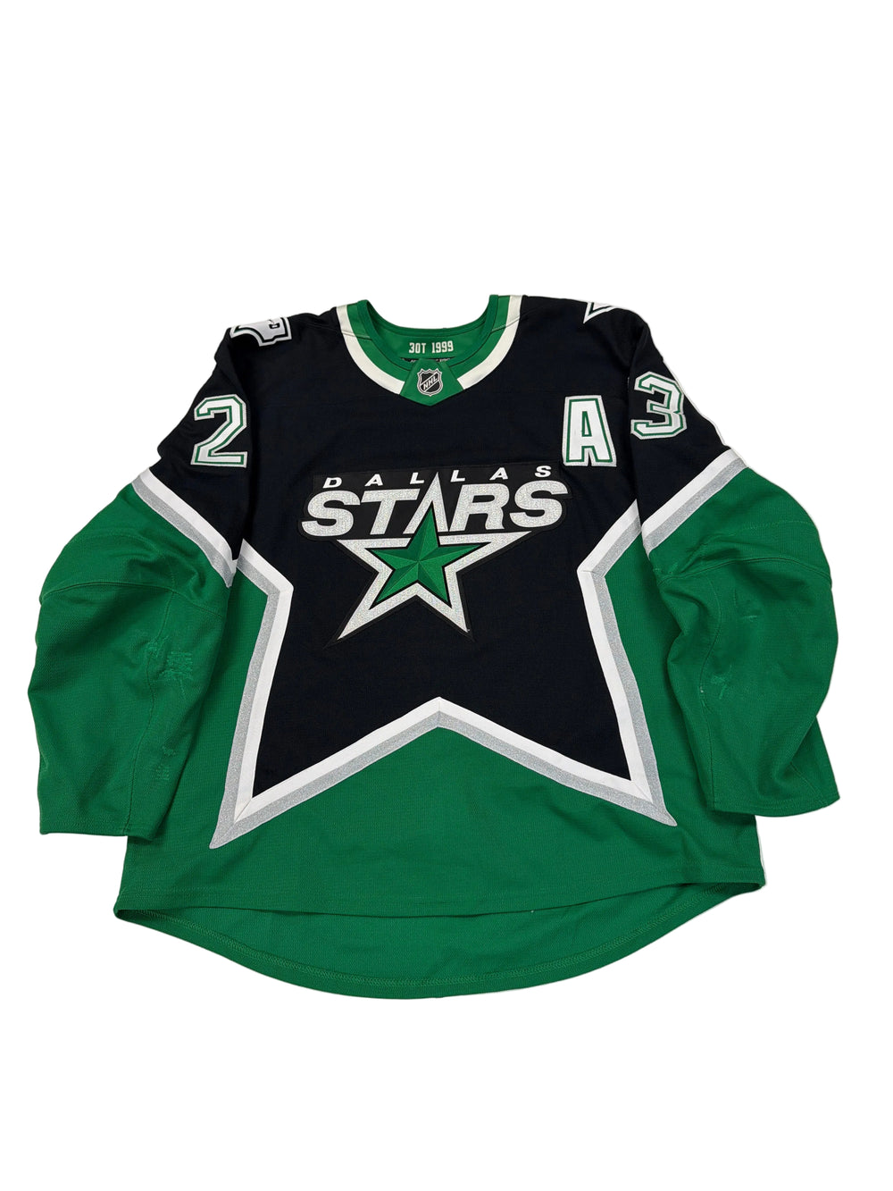 Green and black hoodie with a star logo on a white surface