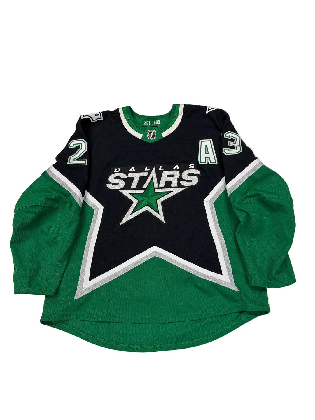 Green and black hoodie with a star logo on a white surface