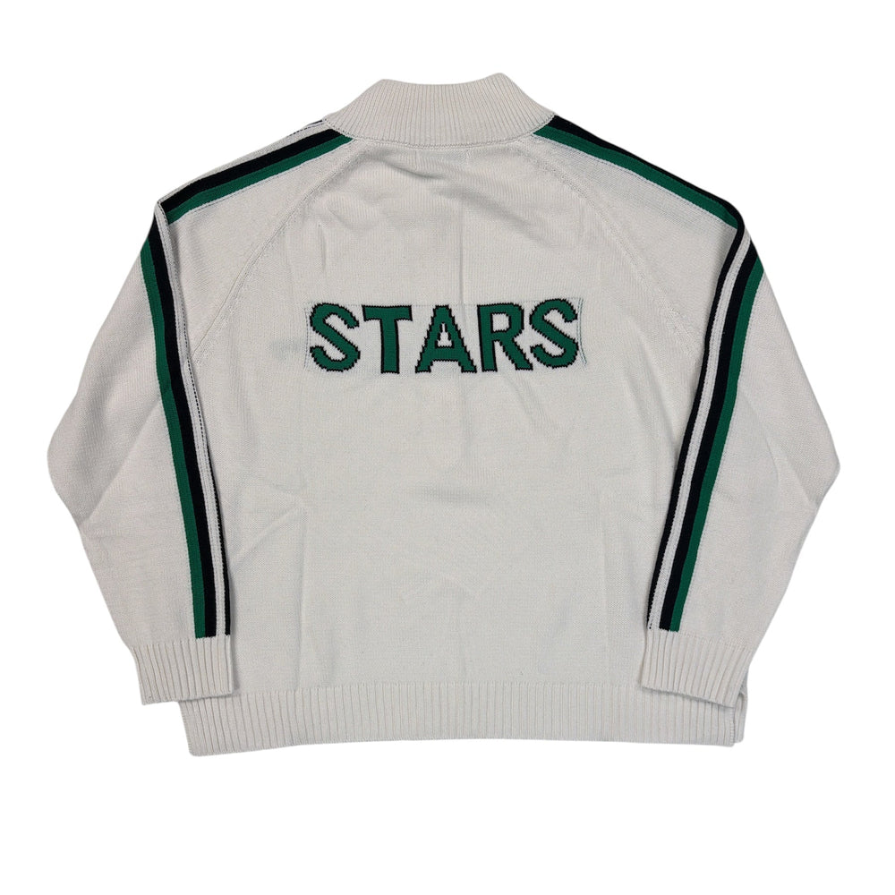 White sweater with green stripes and 'STARS' text on a white background
