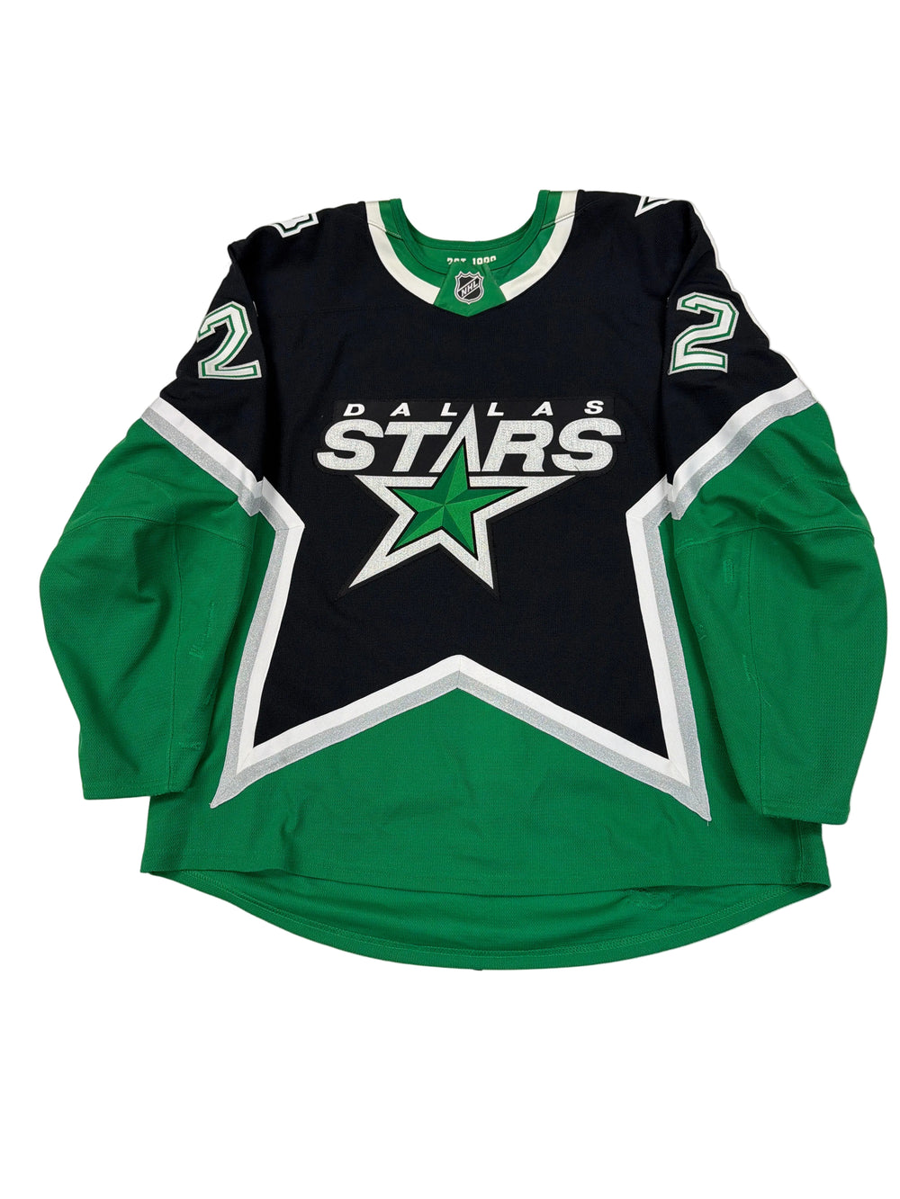 Green and black hoodie with a star logo on a white surface