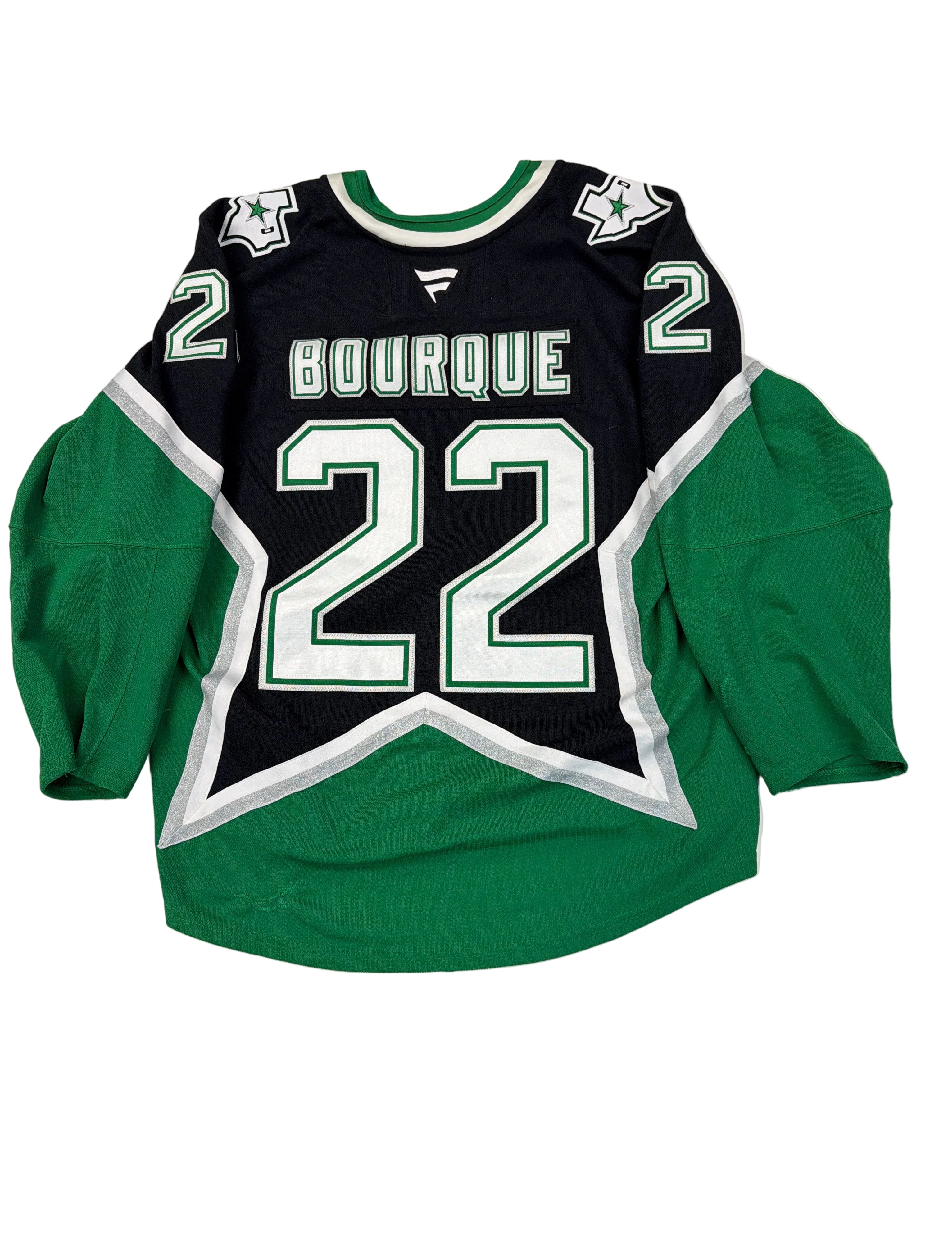 Green and black hoodie with number 2 and text on a white floor.