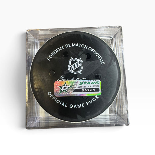 Official NHL hockey puck displayed inside a clear acrylic square case on a white background. The black puck features the white NHL shield logo and &
