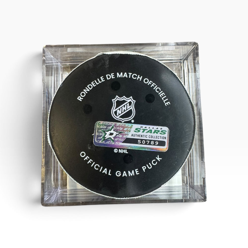 Official NHL Dallas Stars hockey puck in a clear square display case, featuring a black puck with white text and the Dallas Stars authentic collection sticker.