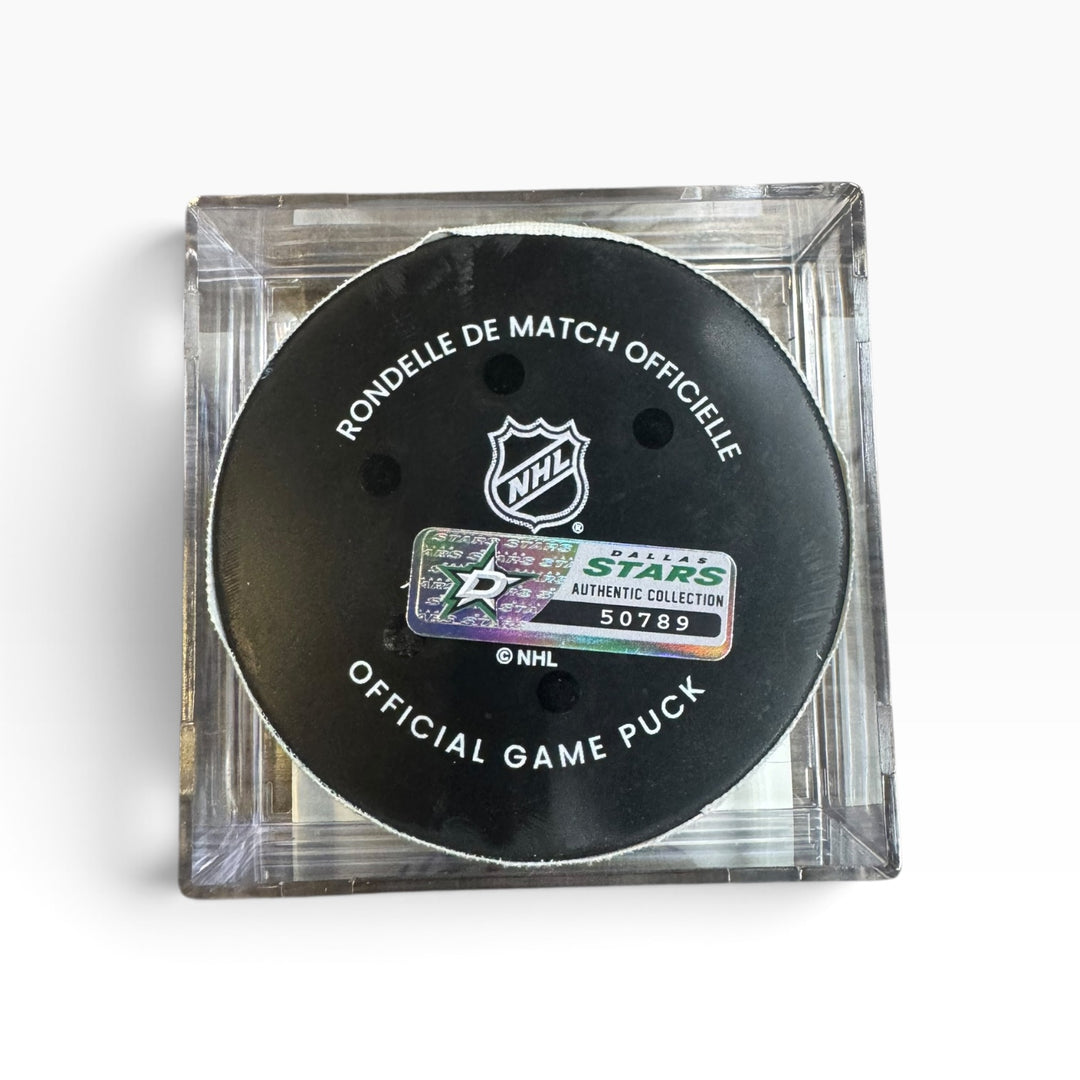 Official NHL Dallas Stars hockey puck in a clear square display case, featuring a black puck with white text and the Dallas Stars authentic collection sticker.