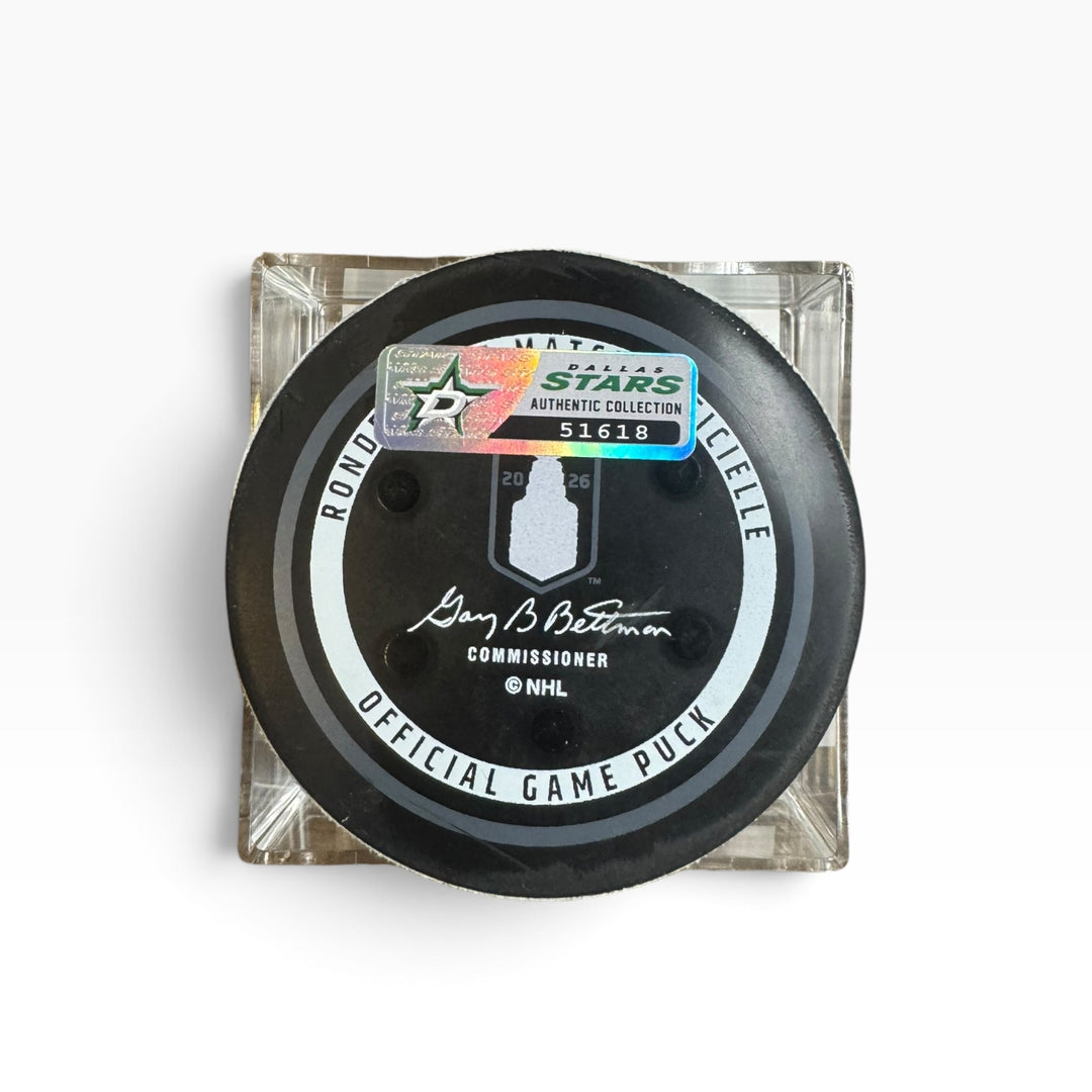 A NHL official game puck in a clear square display case, featuring a black puck with gray and white circle and a holographic Authentic Collection sticker.