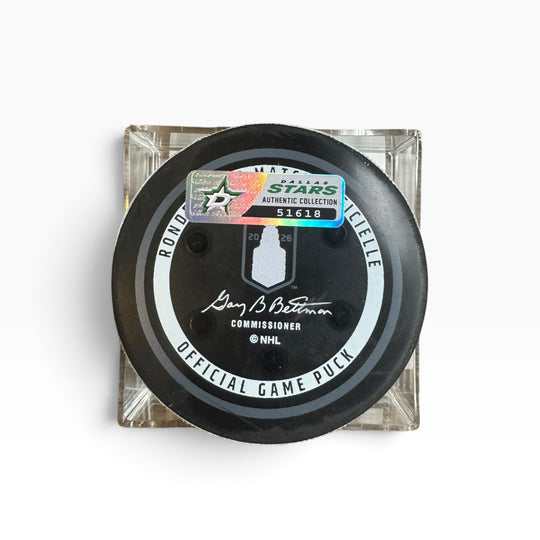 A NHL official game puck in a clear square display case, featuring a black puck with gray and white circle and a holographic Authentic Collection sticker.