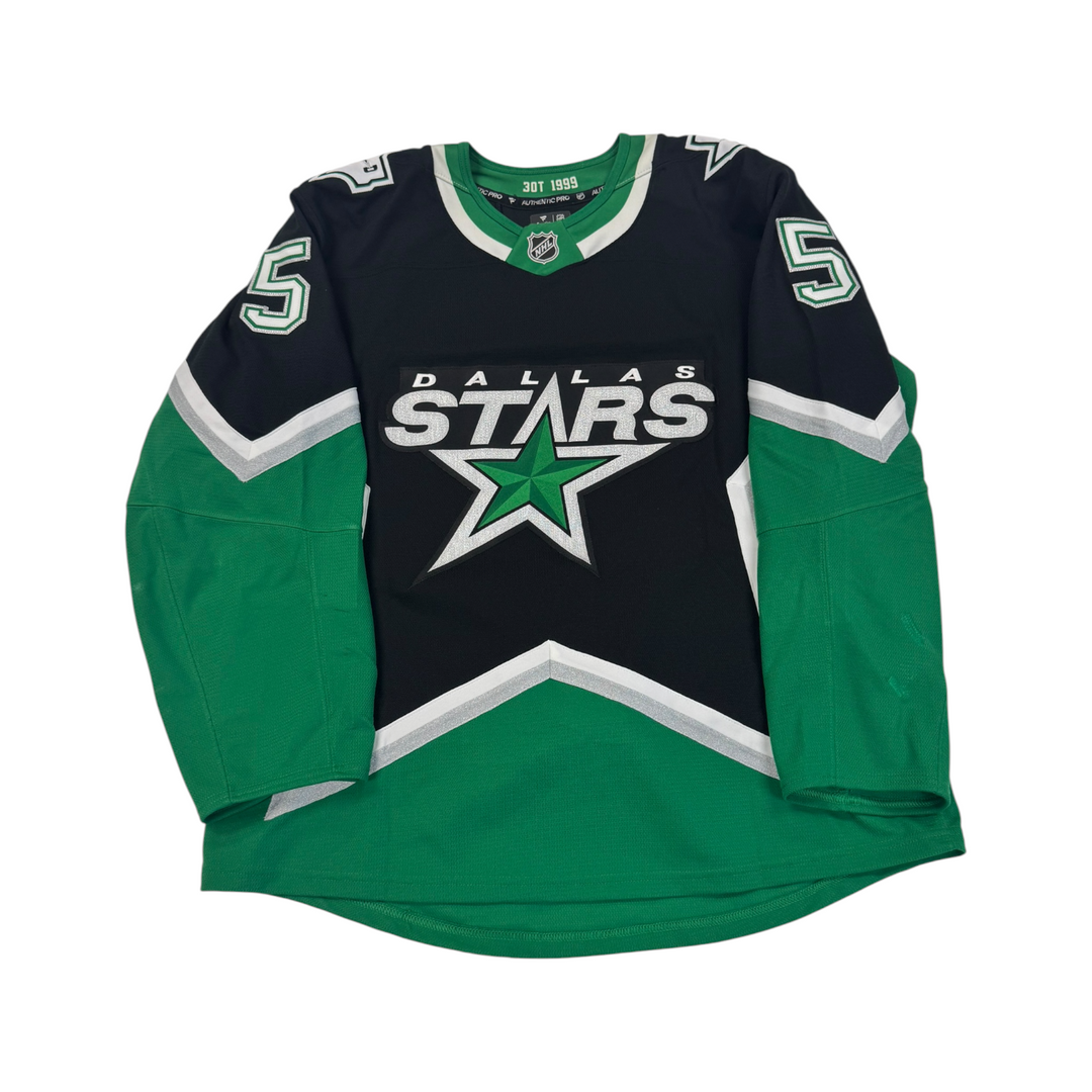 Dallas Stars hockey jersey on a white background.

