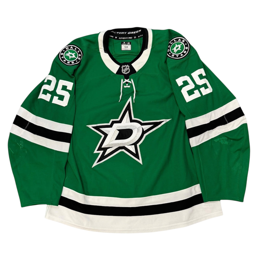 Game Worn Dallas Stars Home hockey jersey with number 25 on sleeves and Stars logo on chest with a white background