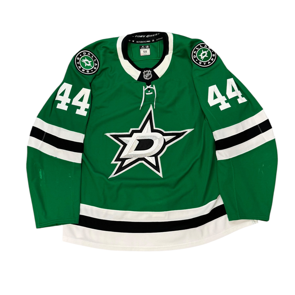 Game Worn Dallas Stars Home hockey jersey with number 44 on sleeves and Stars logo on chest with a white background