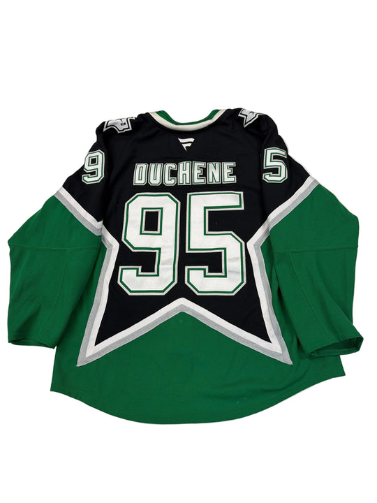 Green and black sports jersey with number 56 and name 'Duchene' on a white surface