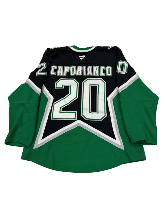 Green and black sports jersey with number 20 and name 'Carobianco' on a white surface.