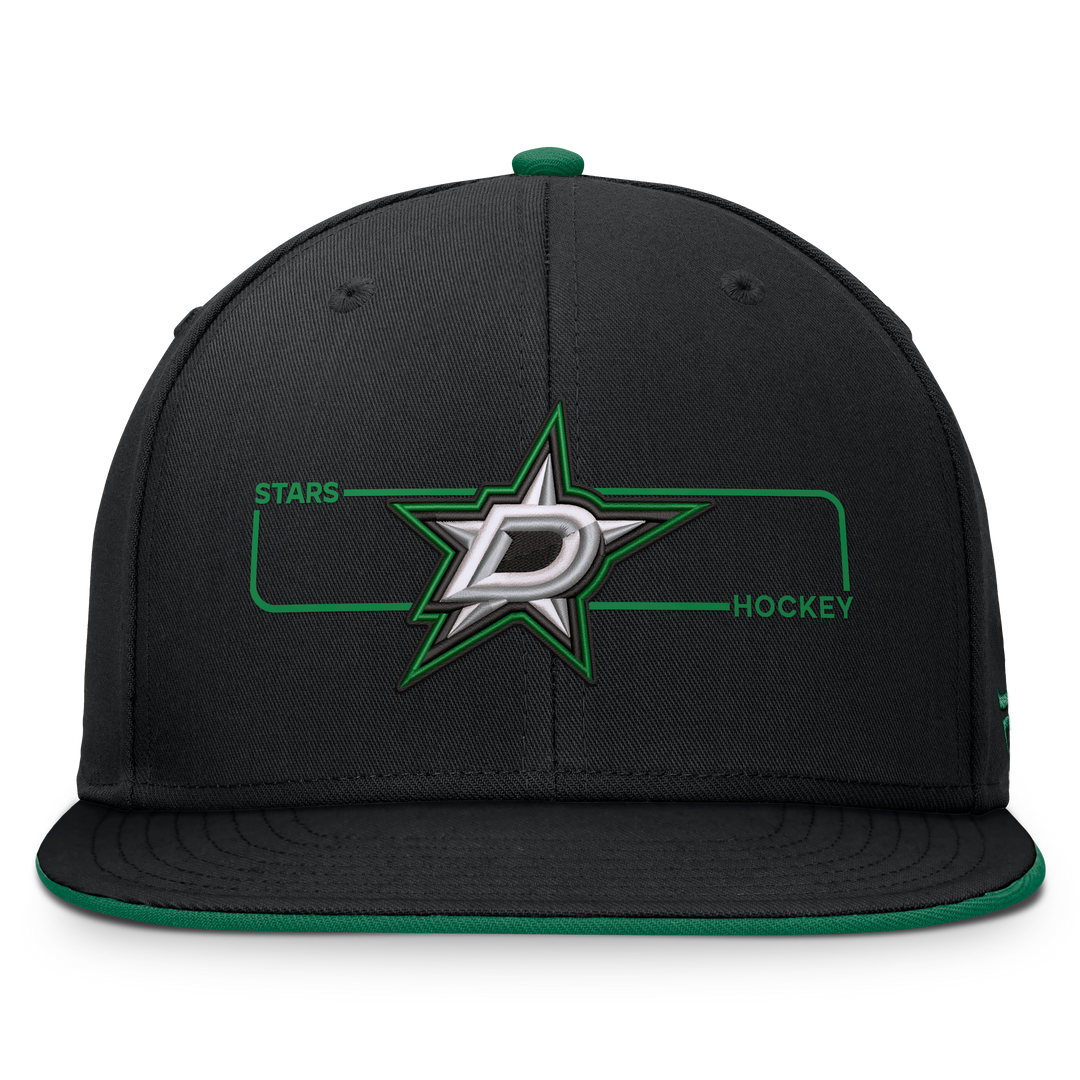 A black Dallas Stars hockey flat-brim cap with a green and silver embroidered logo on the front, featuring a green button and green brim lining.