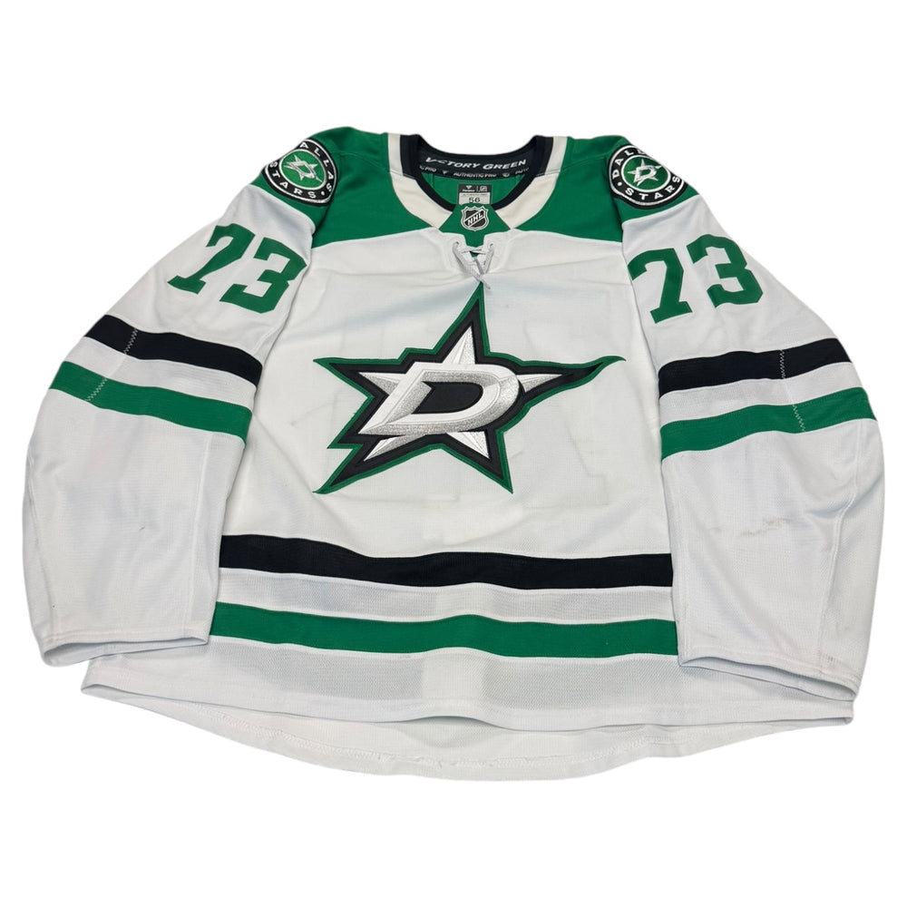 Game worn Dallas Stars Away jersey, number 73 on the sleeves with Dallas Stars logo on the chest. Hockey jersey on a white background
