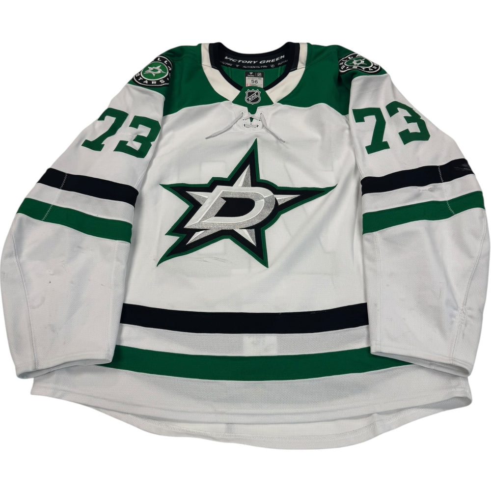 Game worn Dallas Stars Away jersey, number 73 on the sleeves with Dallas Stars logo on the chest. Hockey jersey on a white background
