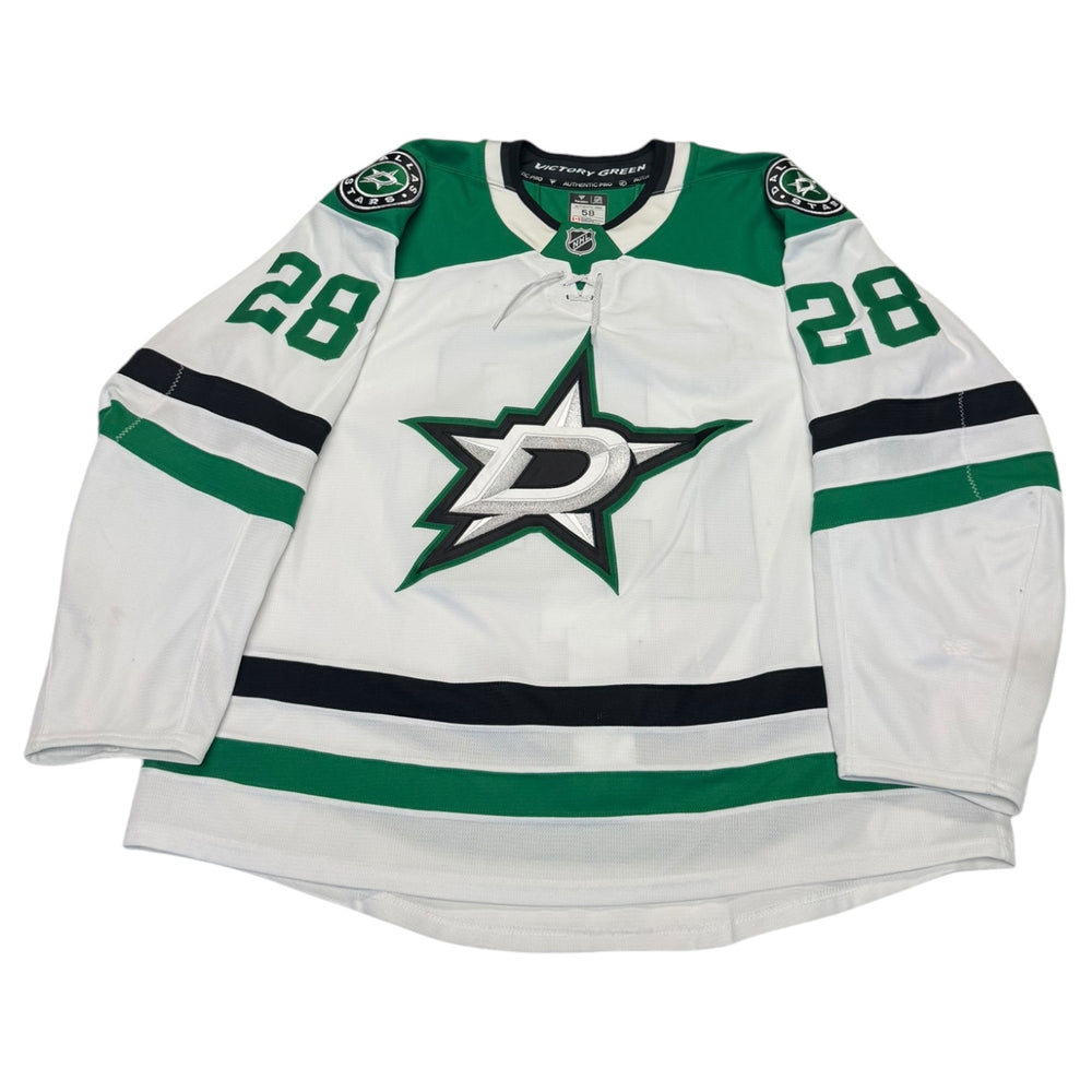 Game worn Dallas Stars Away jersey, number 28 on the sleeves with Dallas Stars logo on the chest. Hockey jersey on a white background

