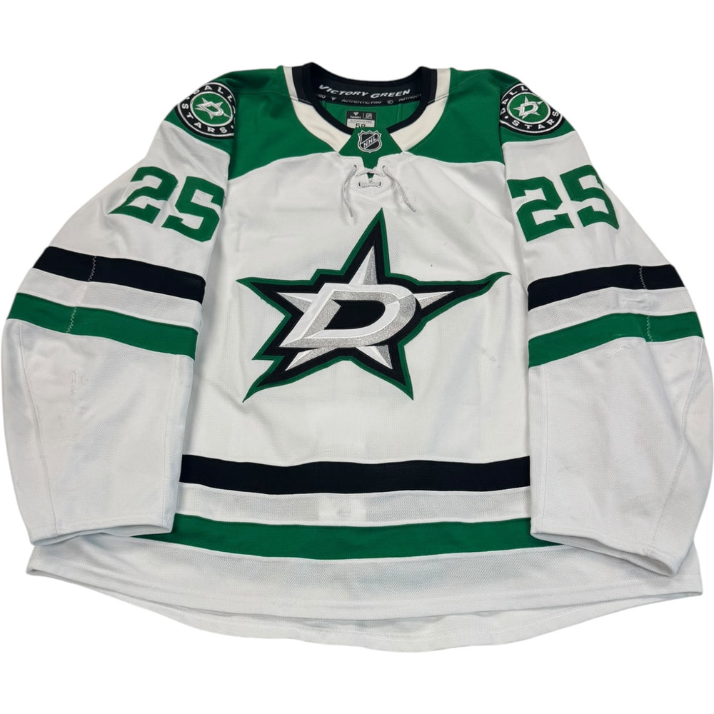 Game worn Dallas Stars Away jersey, number 25 on the sleeves with Dallas Stars logo on the chest. Hockey jersey on a white background
