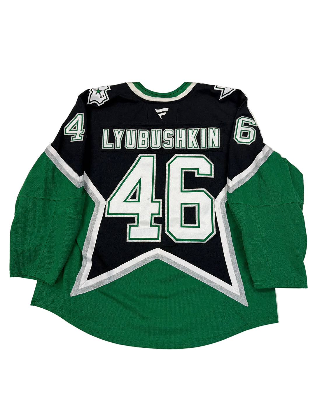 Green and black sports jersey with number 46 on a white surface