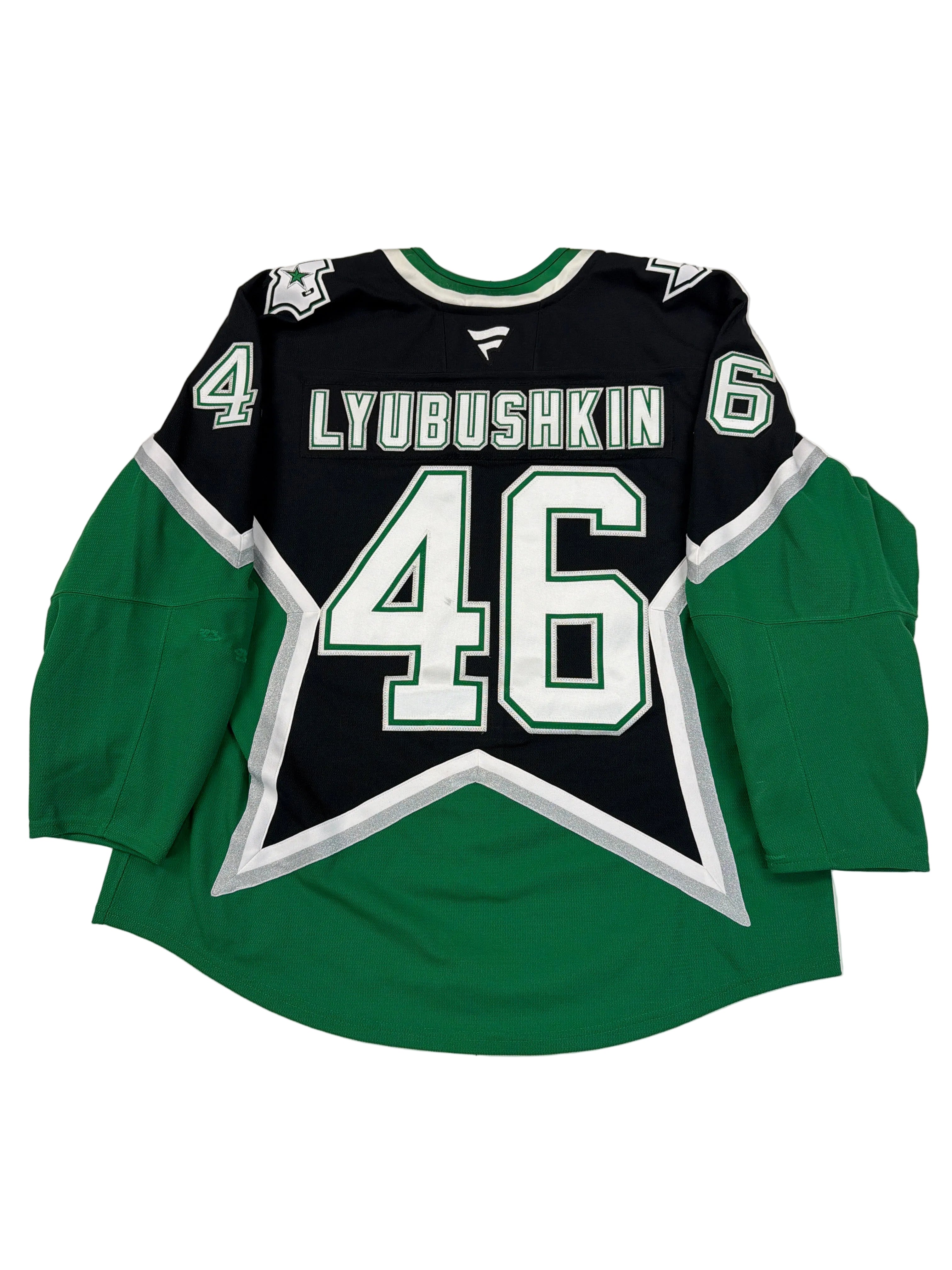 Green and black sports jersey with number 46 on a white surface