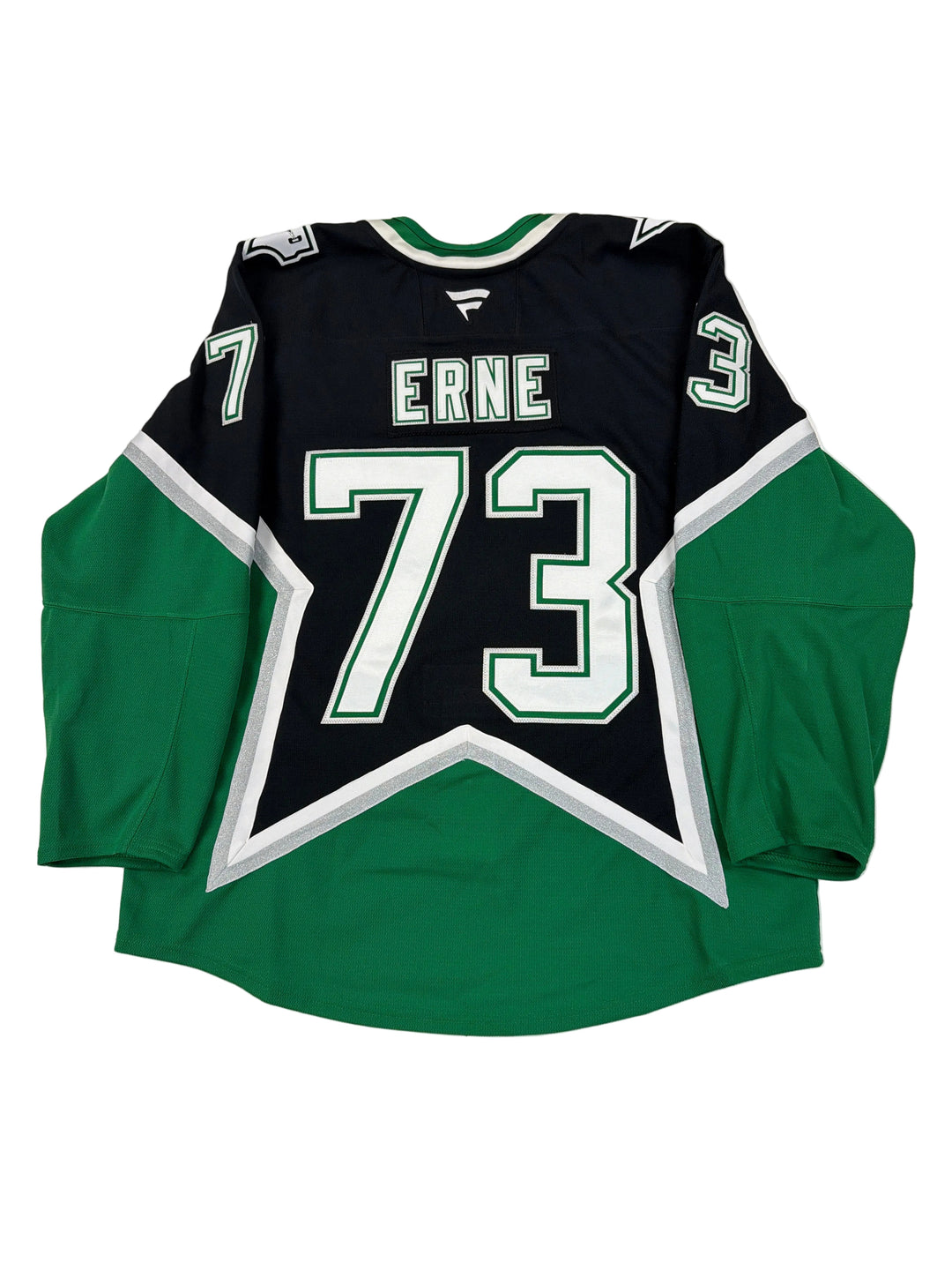 Green and black sports jersey with number 73 and name 'Erne' on a white surface.