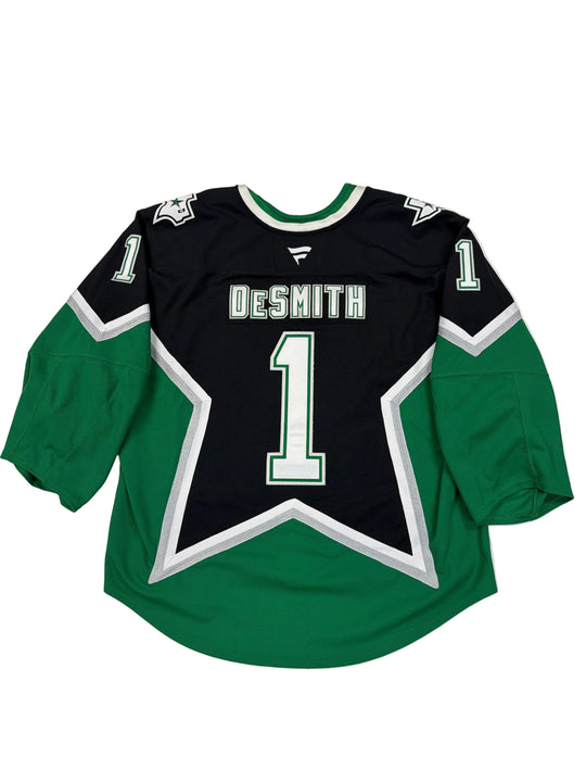 Green and black sports jersey with star design on a white surface
