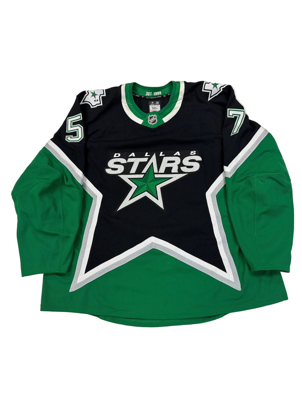 Green and black sports jersey with star design on a white surface