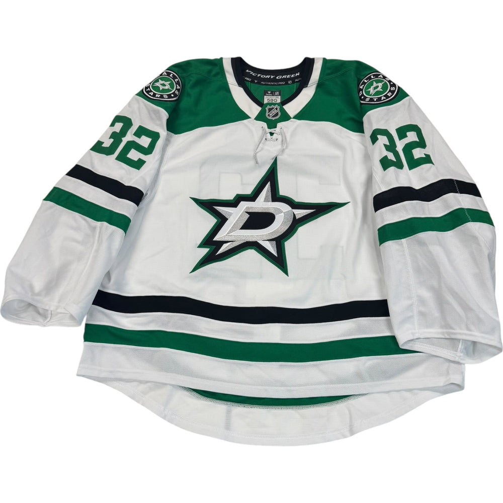 Game worn Dallas Stars Away jersey, number 32 on the sleeves with Dallas Stars logo on the chest. Hockey jersey on a white background
