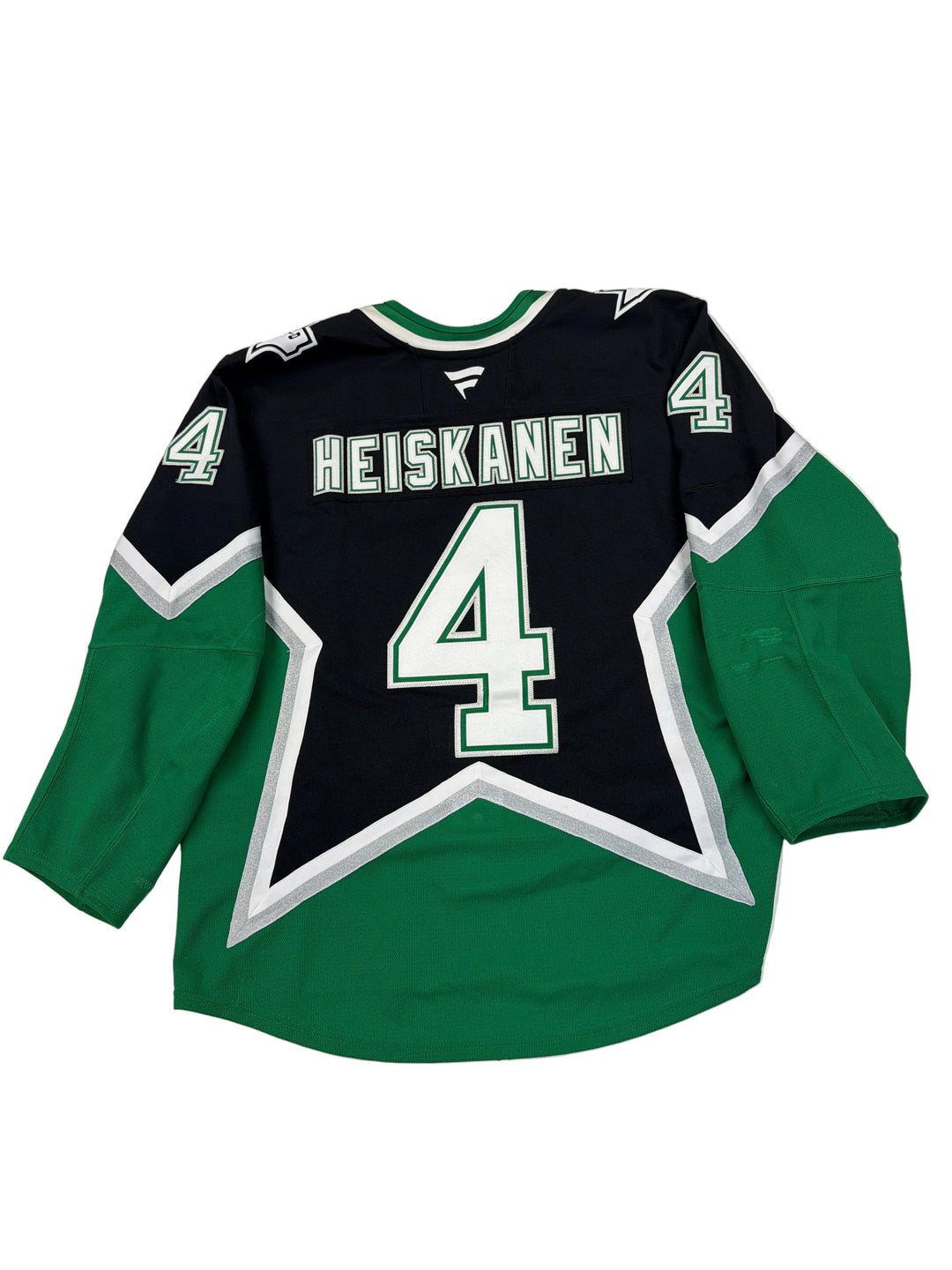 Green and black hoodie with number 4 and name 'Heiskanen' on a white surface.