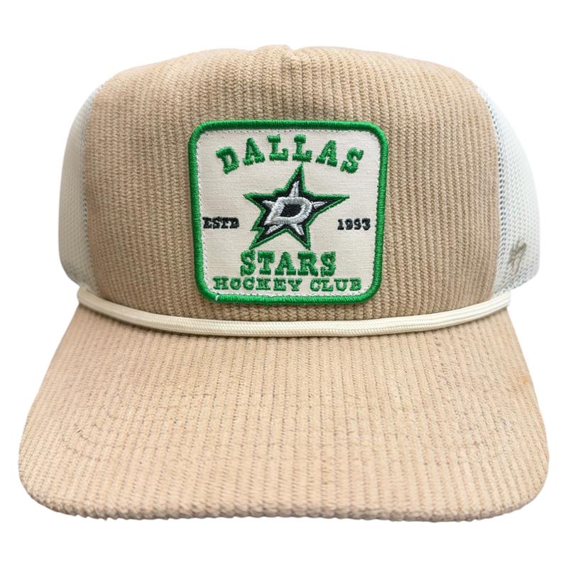 A beige and white trucker hat featuring an embroidered front patch for the Dallas Stars Hockey Club.