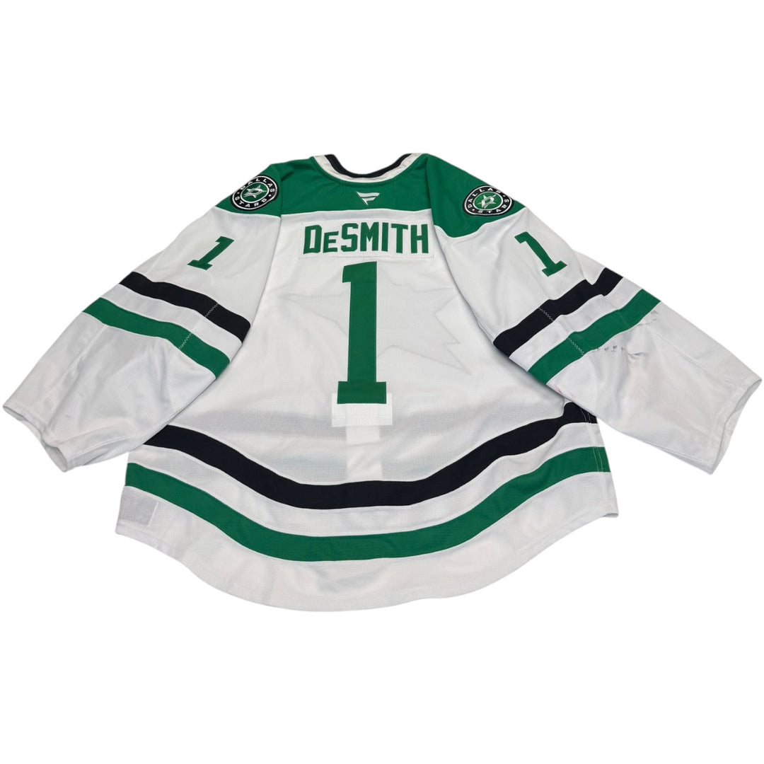 Game worn Dallas Stars away jersey with 'Desmith' and number '1'. Jersey on a white background