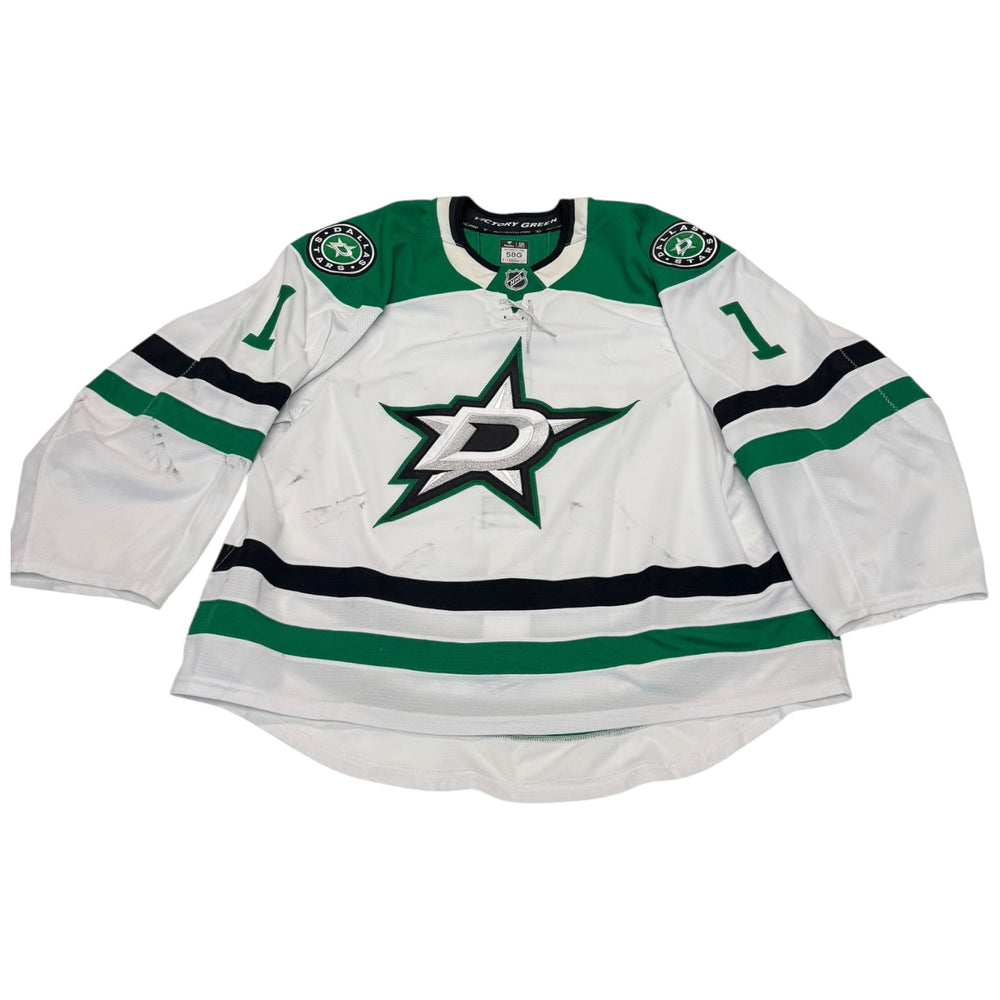 Game worn Dallas Stars Away jersey, number 1 on the sleeves with Dallas Stars logo on the chest. Hockey jersey on a white background
