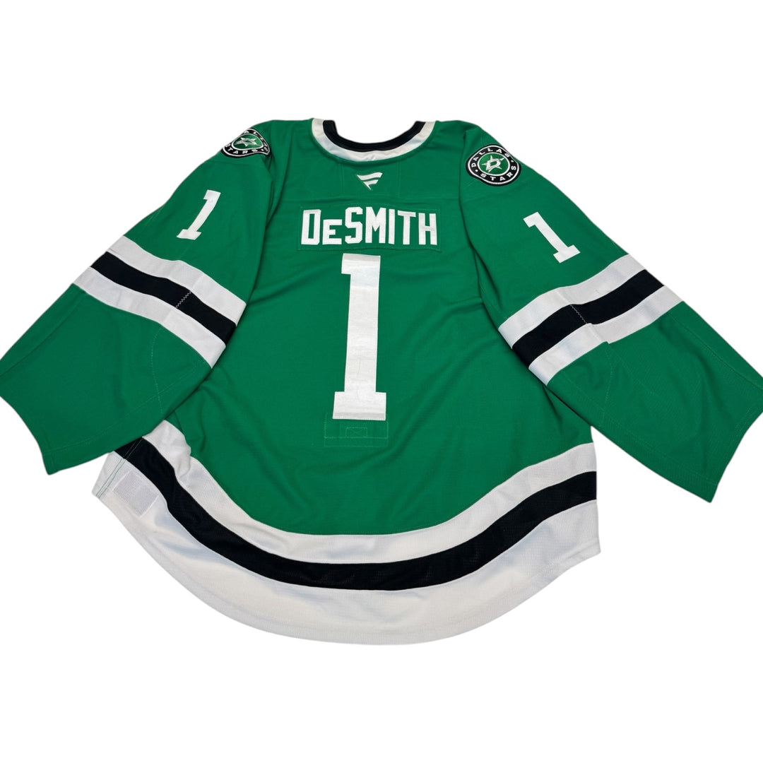 Game worn Dallas Stars home hockey jersey with 'Desmith' and number '1' on a white background