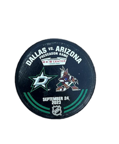 Photo of Warm up from from front view. Dallas Stars and Arizona Coyotes logo. Date. Location.