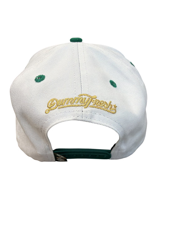 White cap with green accents and embroidered text on a white background