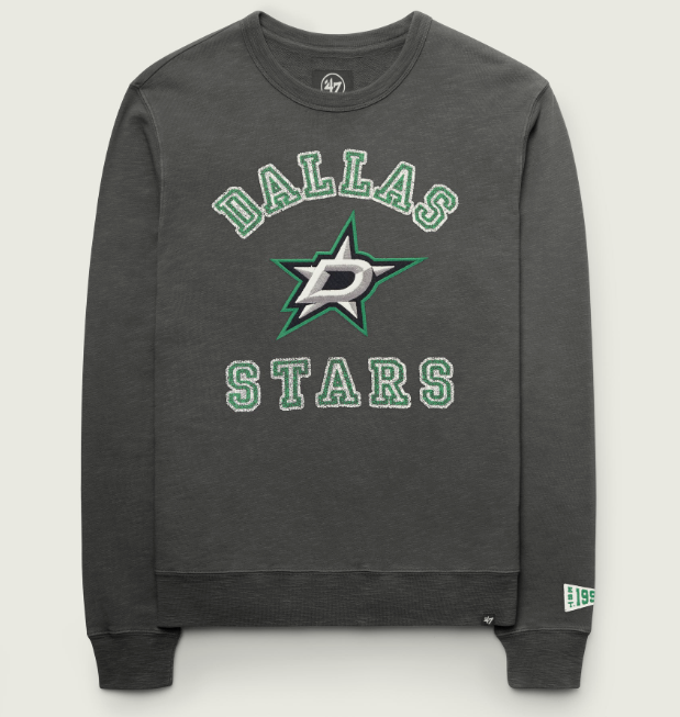Gray Dallas Stars crewneck sweatshirt featuring green and white embroidered-style “DALLAS” and “STARS” lettering surrounding the Dallas Stars logo on the chest. Includes ribbed cuffs and hem, with a small commemorative pennant detail on the lower sleeve. Flat-lay product image on a white background.