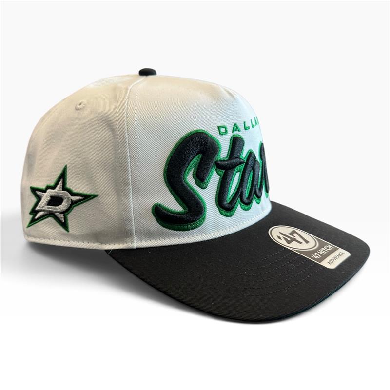 A Dallas Stars baseball cap with an off-white crown, black visor, green and black embroidered 'Dallas Stars' text, a green star logo on the side, and a '47 brand sticker on the visor.