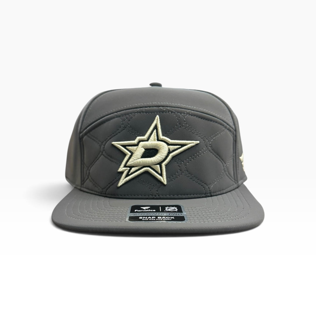 GREY TEXTURED DALLAS STARS SNAP BACK CAP. GOLD PRIMARY LOGO