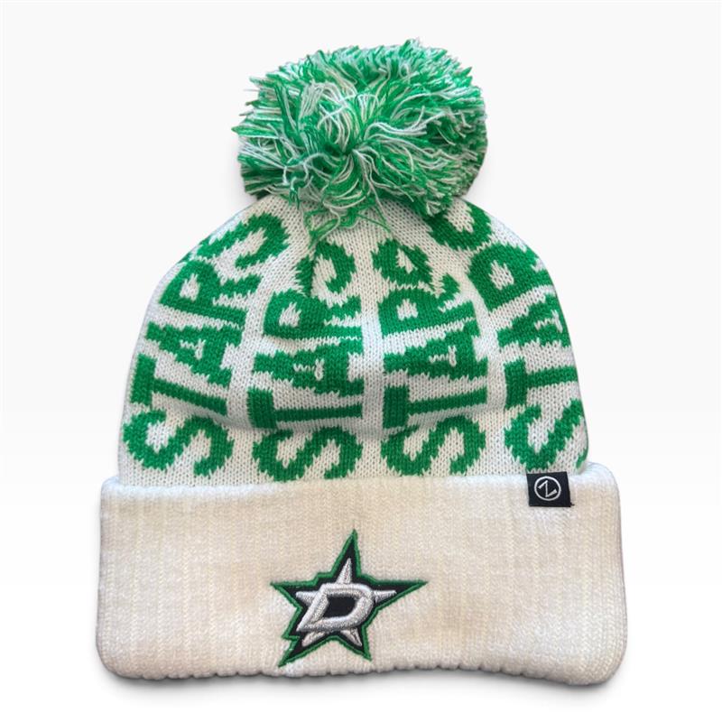 A knit beanie hat with a green and off-white pom-pom, featuring the Dallas Stars logo and name patterned on the upper section, and a folded cuff with the Dallas Stars star logo.